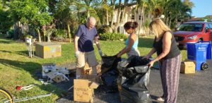 residents helping clean up garden patio villas